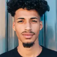 confident-ethnic-man-with-curly-hair